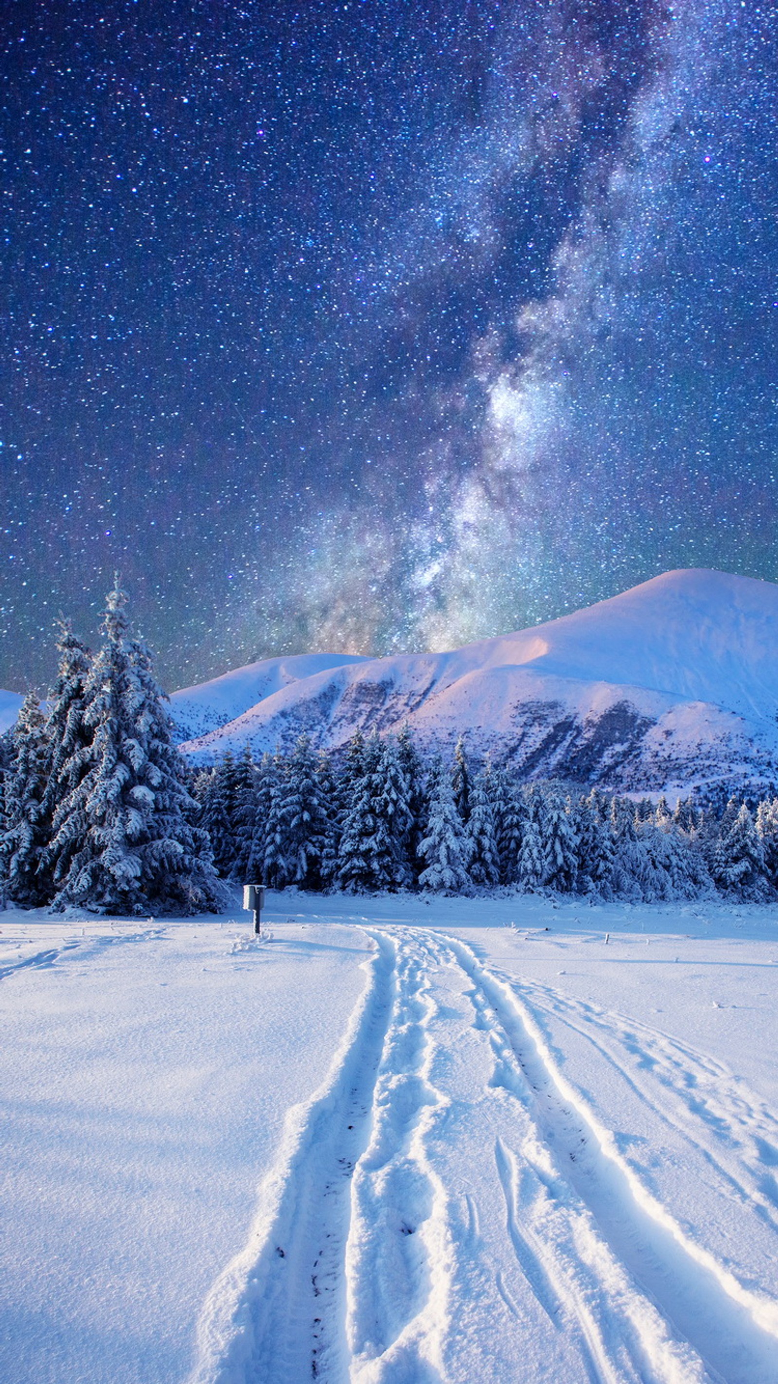 Snowy landscape with tracks in the snow and a milky in the sky (landscape, mountains, nature, night, sky)