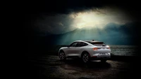 Ford Mustang Mach-E against a dramatic backdrop, showcasing sleek lines and modern design under moody lighting.