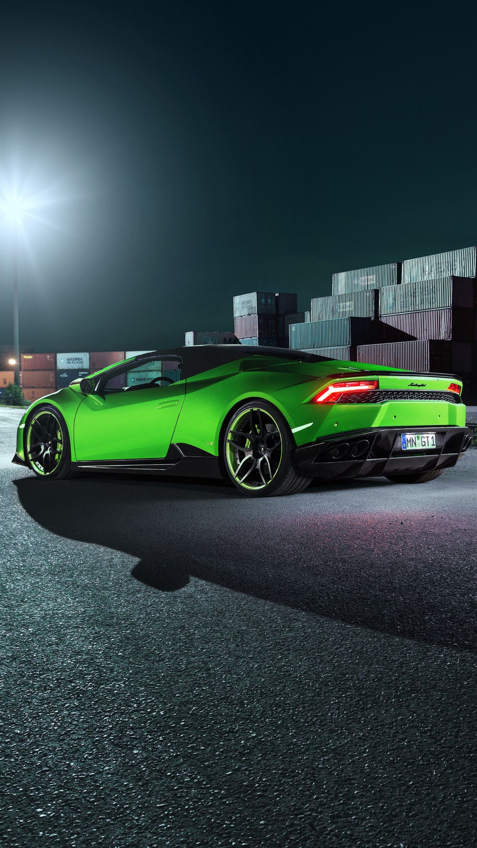 Lamborgon on the road at night with a cargo container in the background (lamborghini, cars, lamborghini aventador, sports car, supercar)