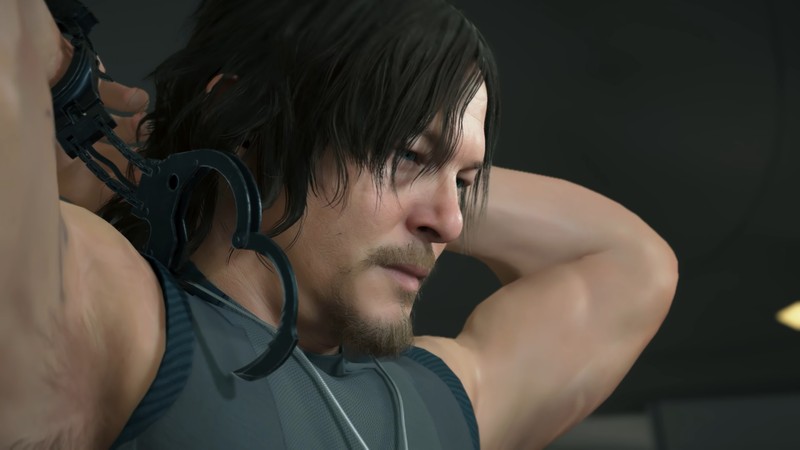 Крупный план человека с наушником (death stranding, видеоигра, норман ридус, norman reedus)