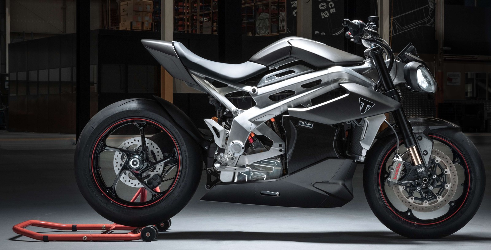 A close up of a motorcycle parked in a garage (triumph te 1, electric bikes, electric sports bikes, 2022, 5k)