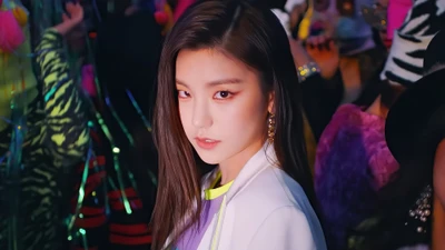 Yeji from ITZY exudes confidence and charisma in a vibrant, colorful scene from the "Wannabe" music video.