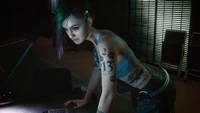 Judy Alvarez in Cyberpunk 2077: A Futuristic Hacker with Edgy Tattoos and Vibrant Hair