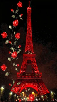 Rosas rojas adornan la iluminada Torre Eiffel