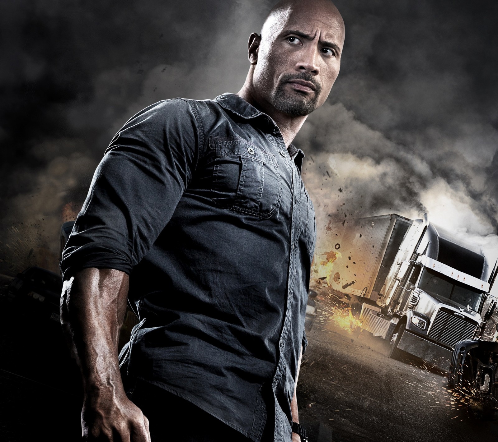 A close up of a man standing in front of a truck (dwayne johnson, the rock)