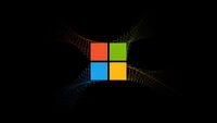 Logotipo de Microsoft Windows sobre fondo negro con efectos de arte digital