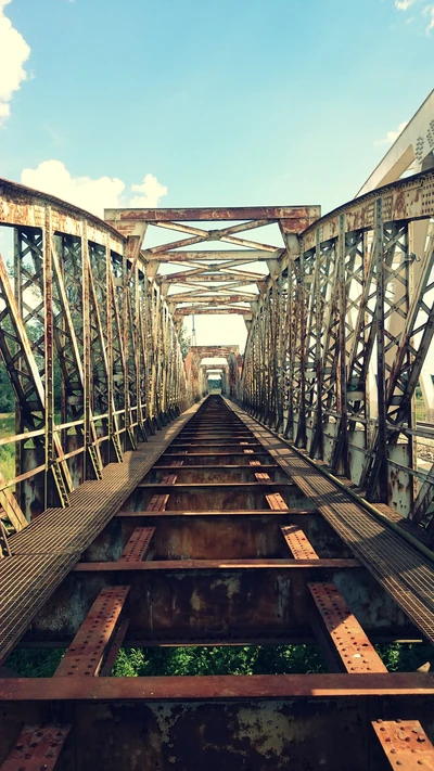 Rusty Railway Bridge Overlooking a River in Poland