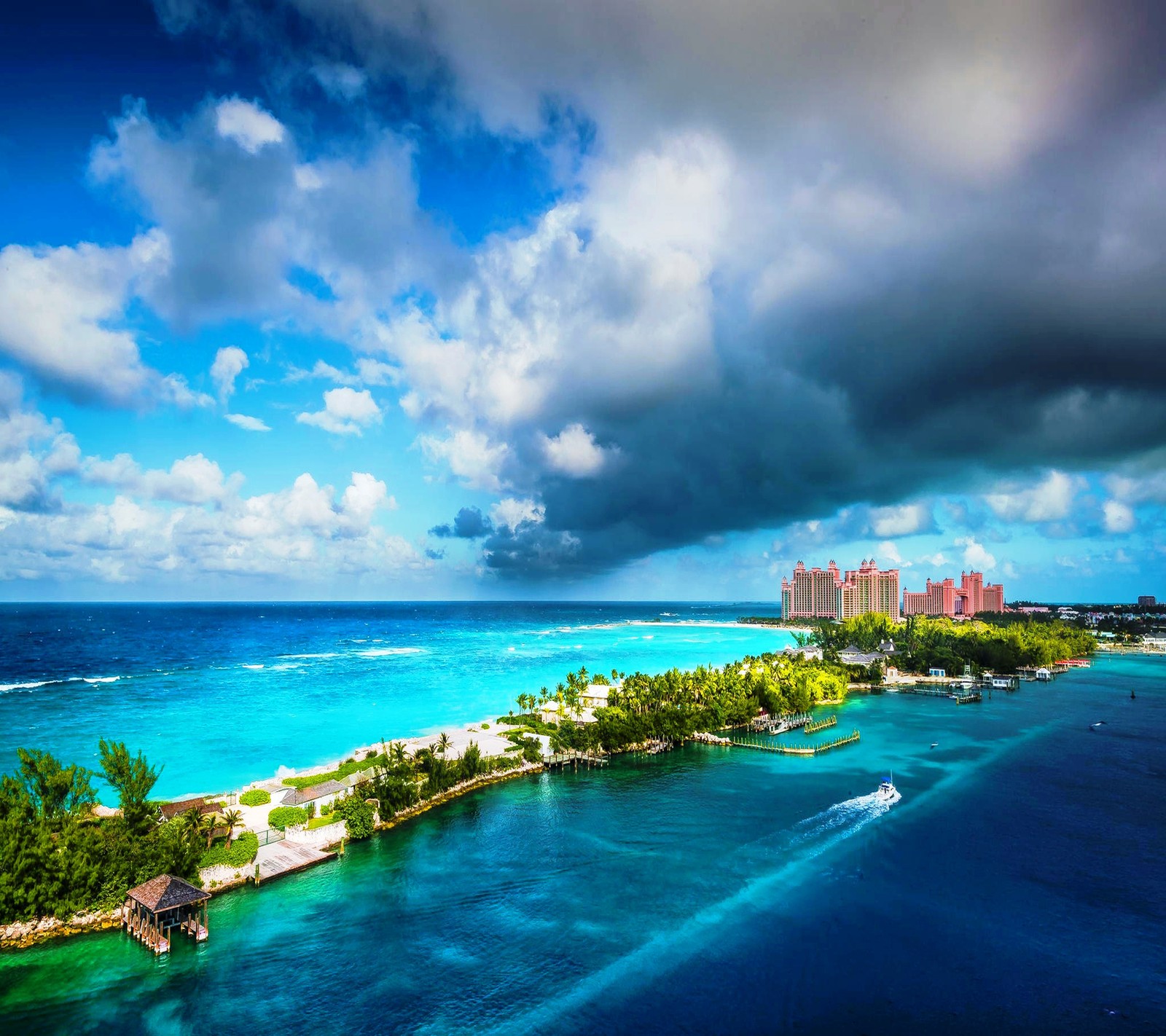 Arafed view of a tropical island with a boat in the water (paradise, tropical)