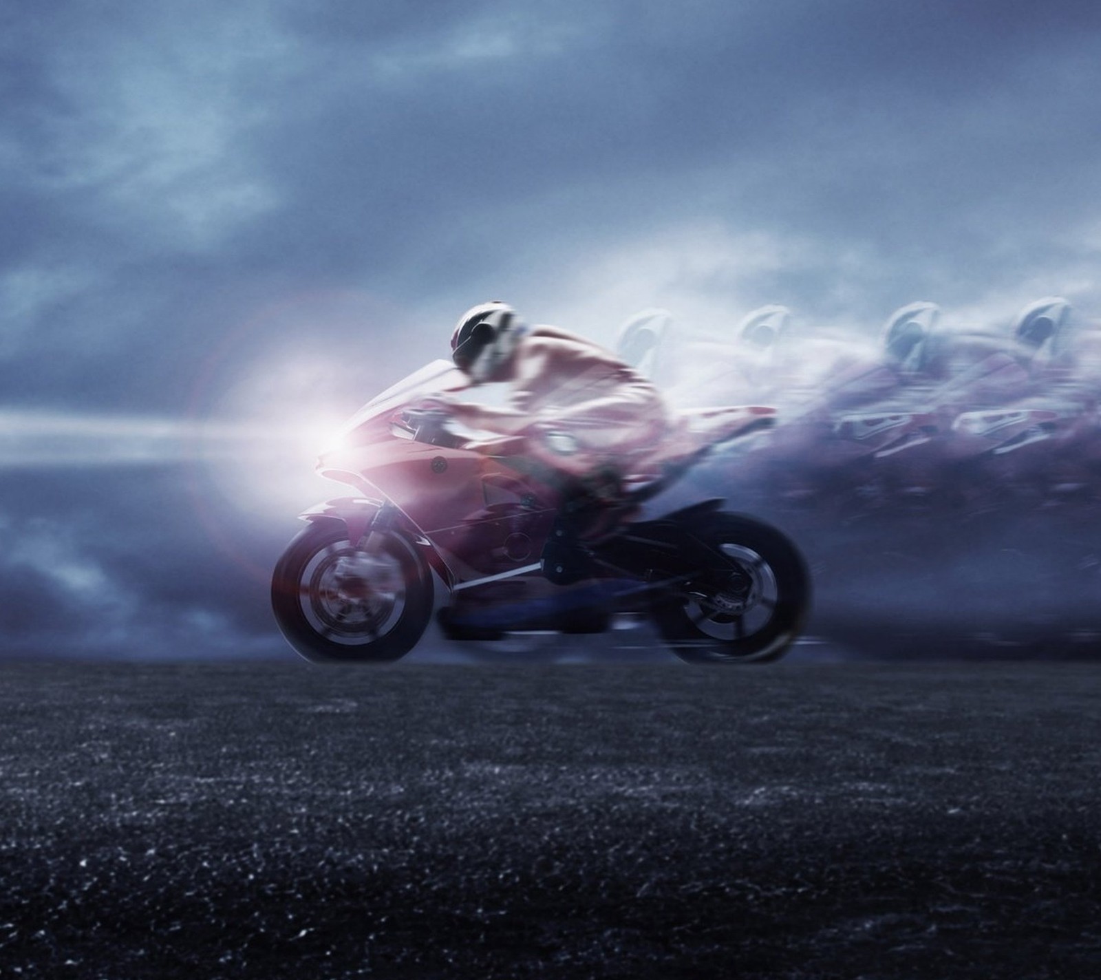 There is a man riding a motorcycle on a field with a lot of smoke (bike, motorcycle, speed)