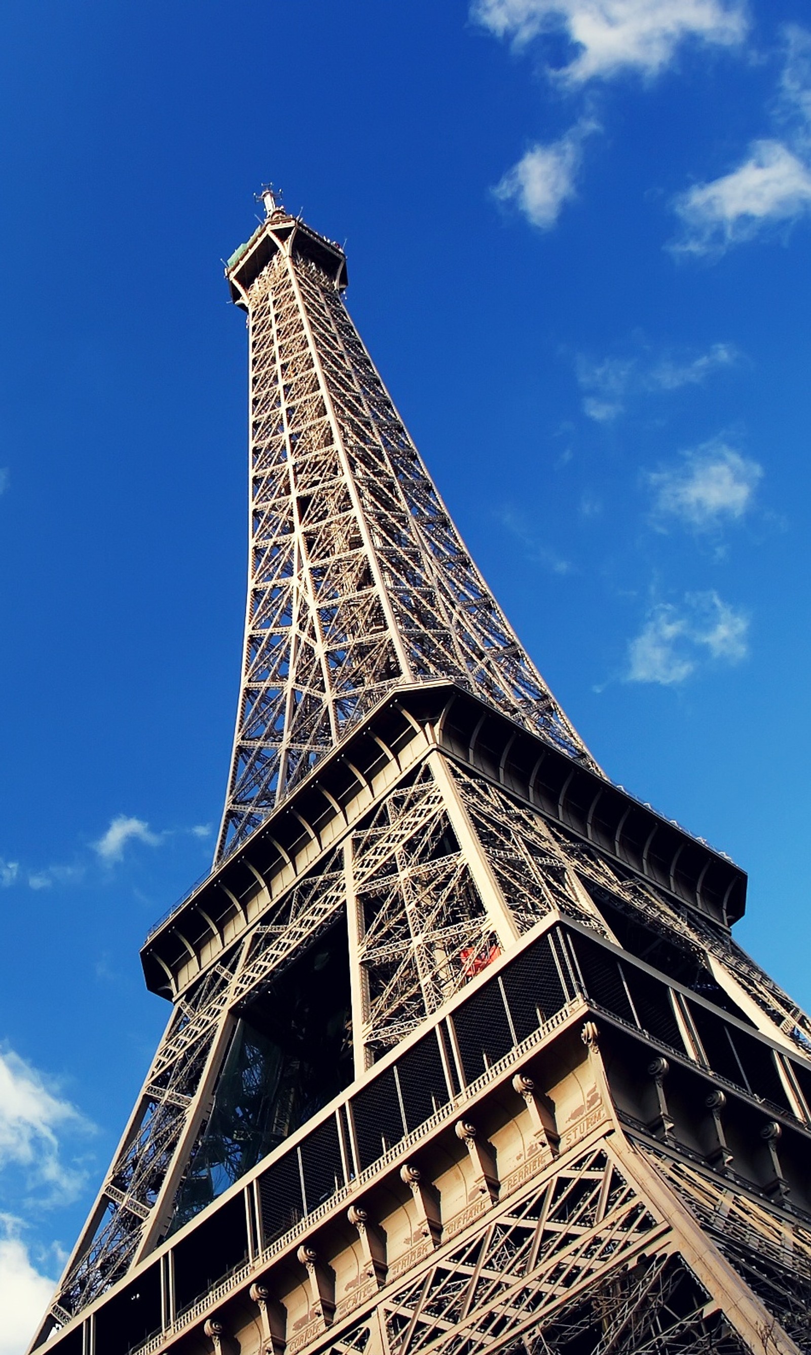 Araffe view of the eiffel tower with a blue sky in the background (eiffel, paris, tower)