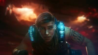 Kait Diaz from Gears 5 in a dramatic, intense moment of struggle amidst a fiery backdrop.