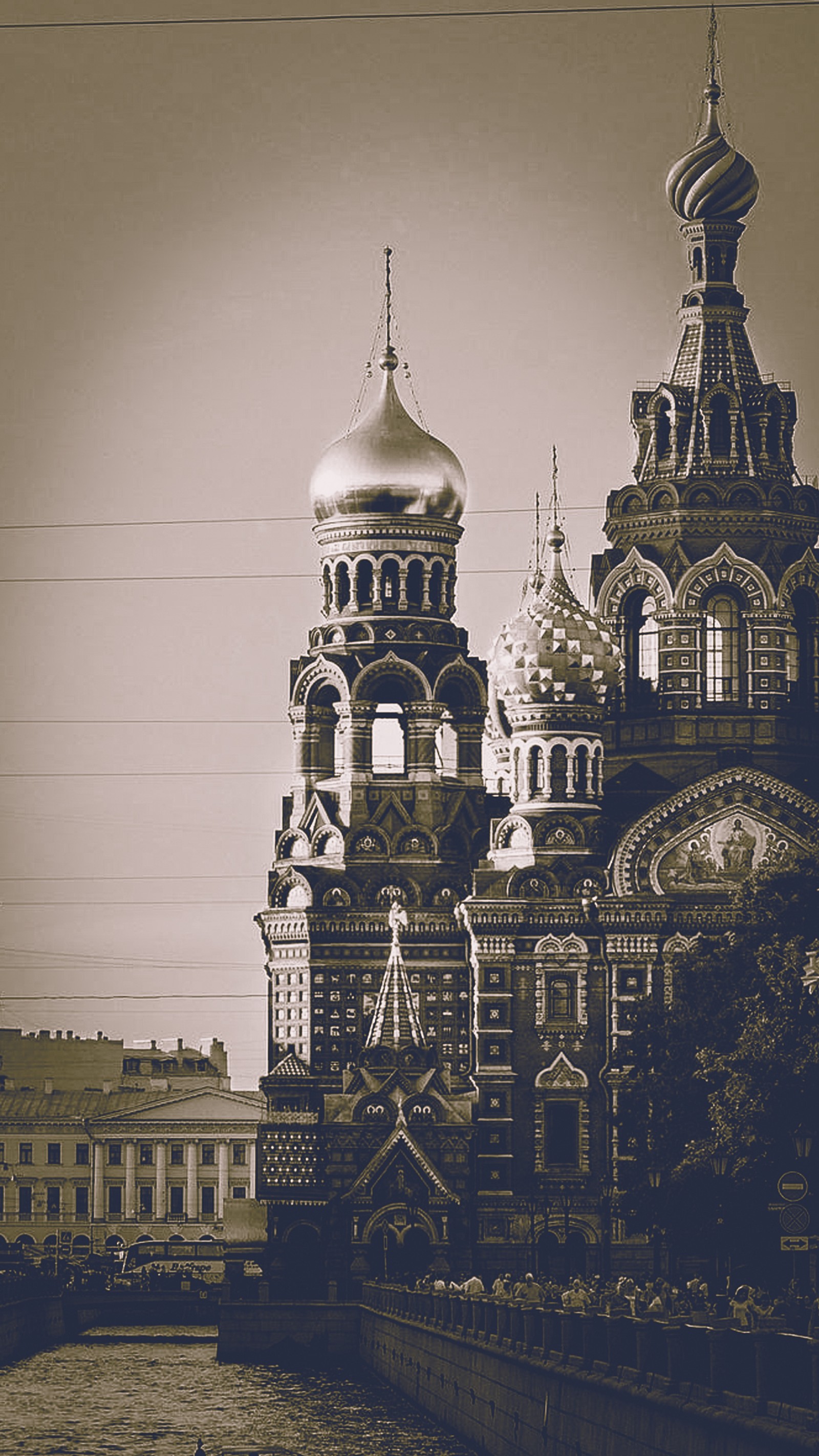 There is a black and white photo of a church with a clock tower (blood, russia, saint petersburg, savior, spilled)