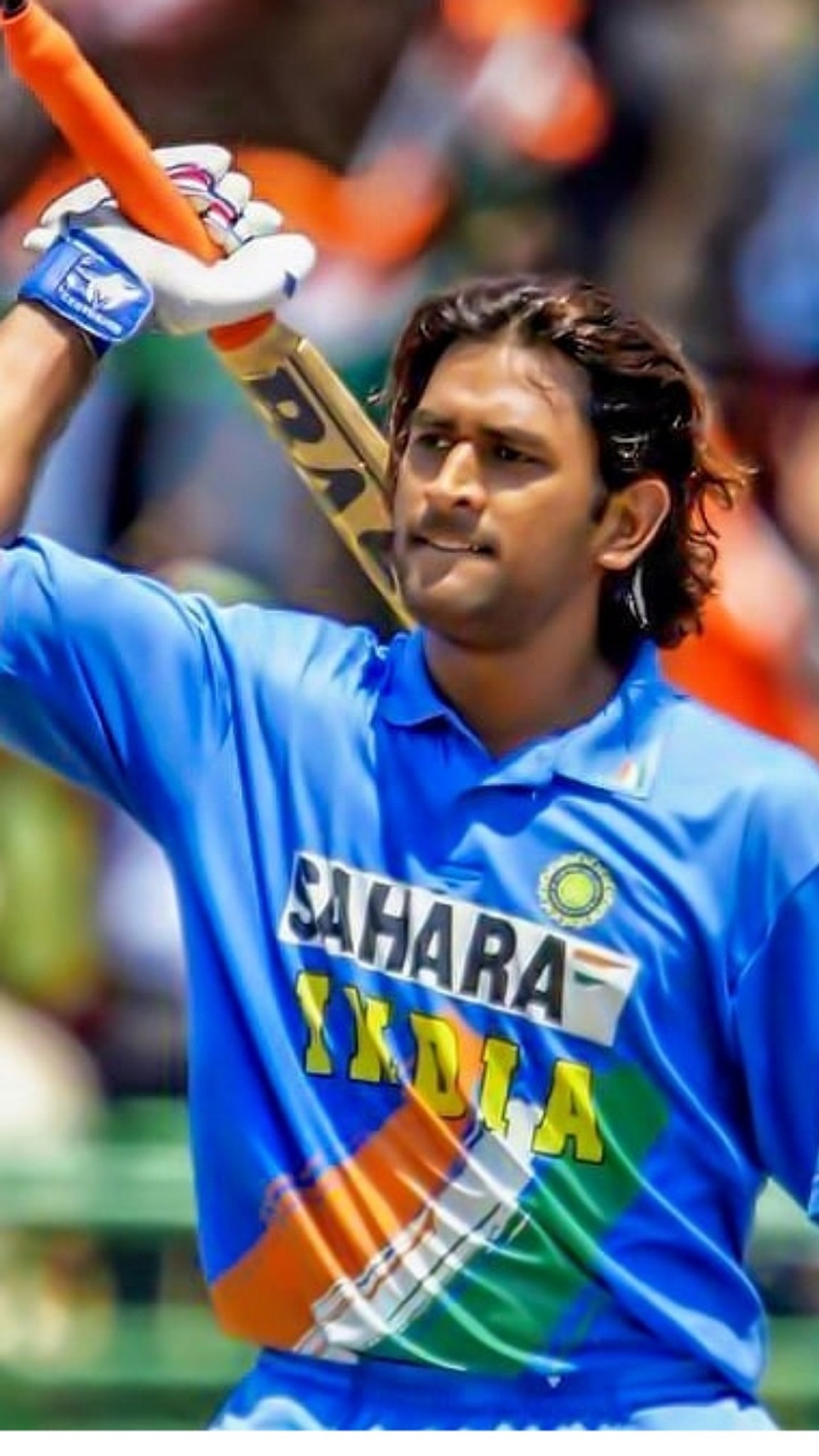 A close up of a man holding a bat in his hand (bcci, blue, cricket, dhoni, india)