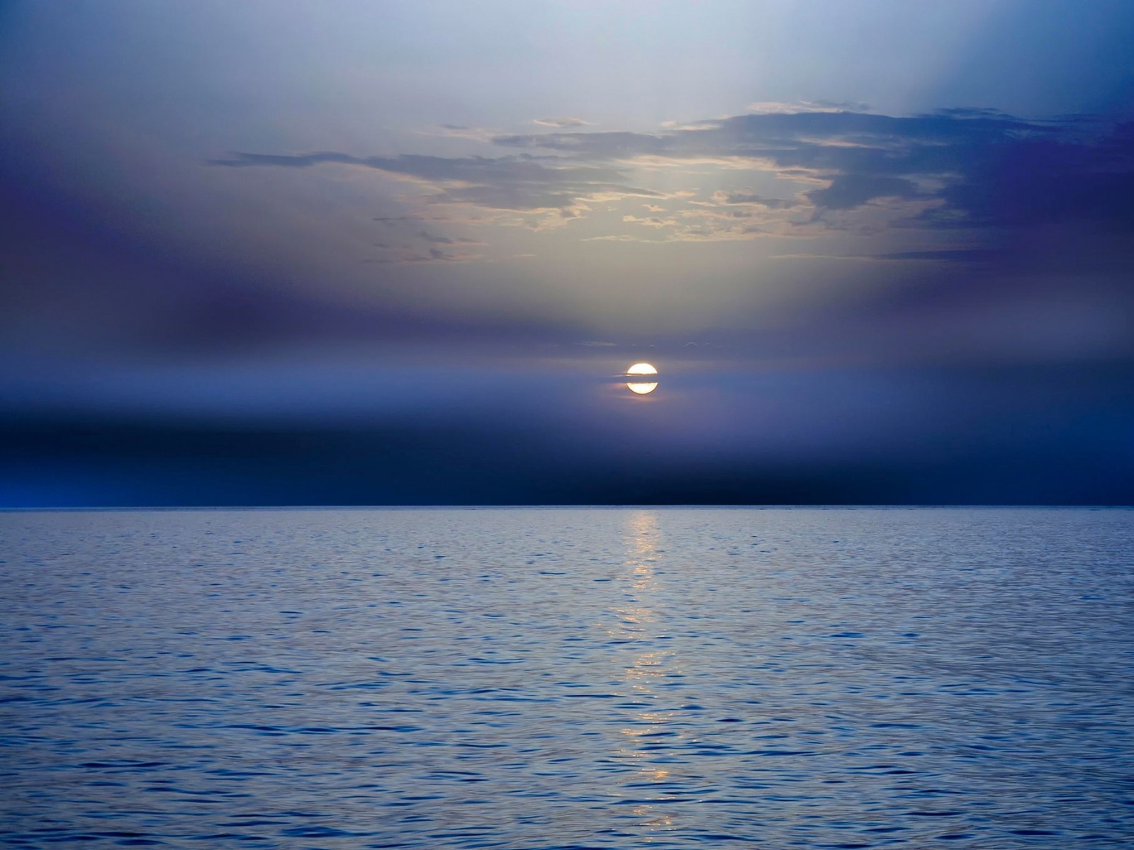 Arafed view of a sun setting over the ocean with a boat in the water (horizon, sunset, sunrise, sea, water)