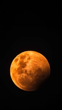 Luna de cosecha durante un eclipse lunar