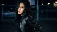 Ningning of aespa showcasing fierce charisma in a stylish leather jacket at night.