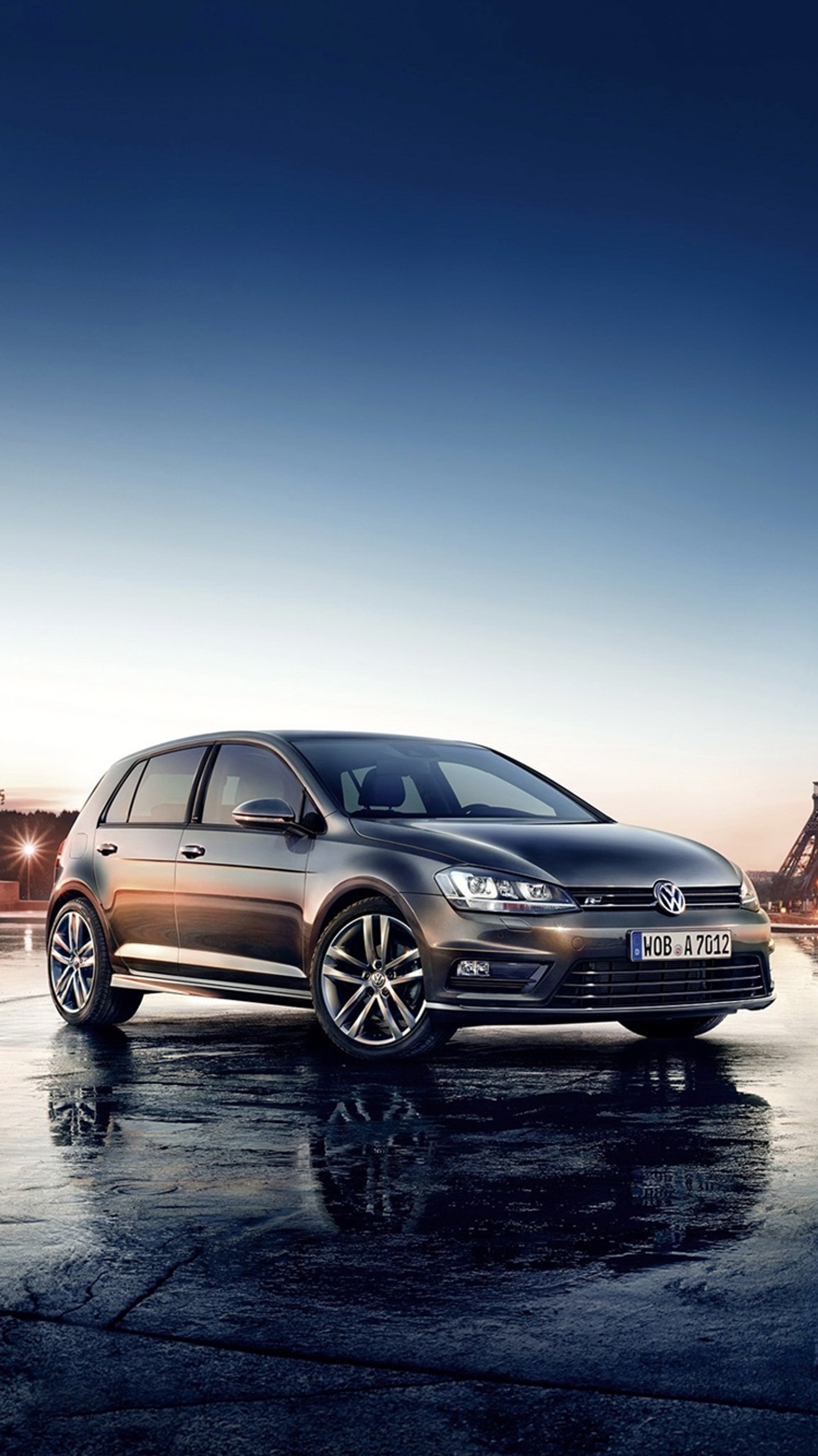 A close up of a silver volkswagen golf parked in front of a building (auto, car, golf r, mk7, vehicle)