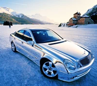 Chrome Mercedes E-Class E55 on a snowy landscape.