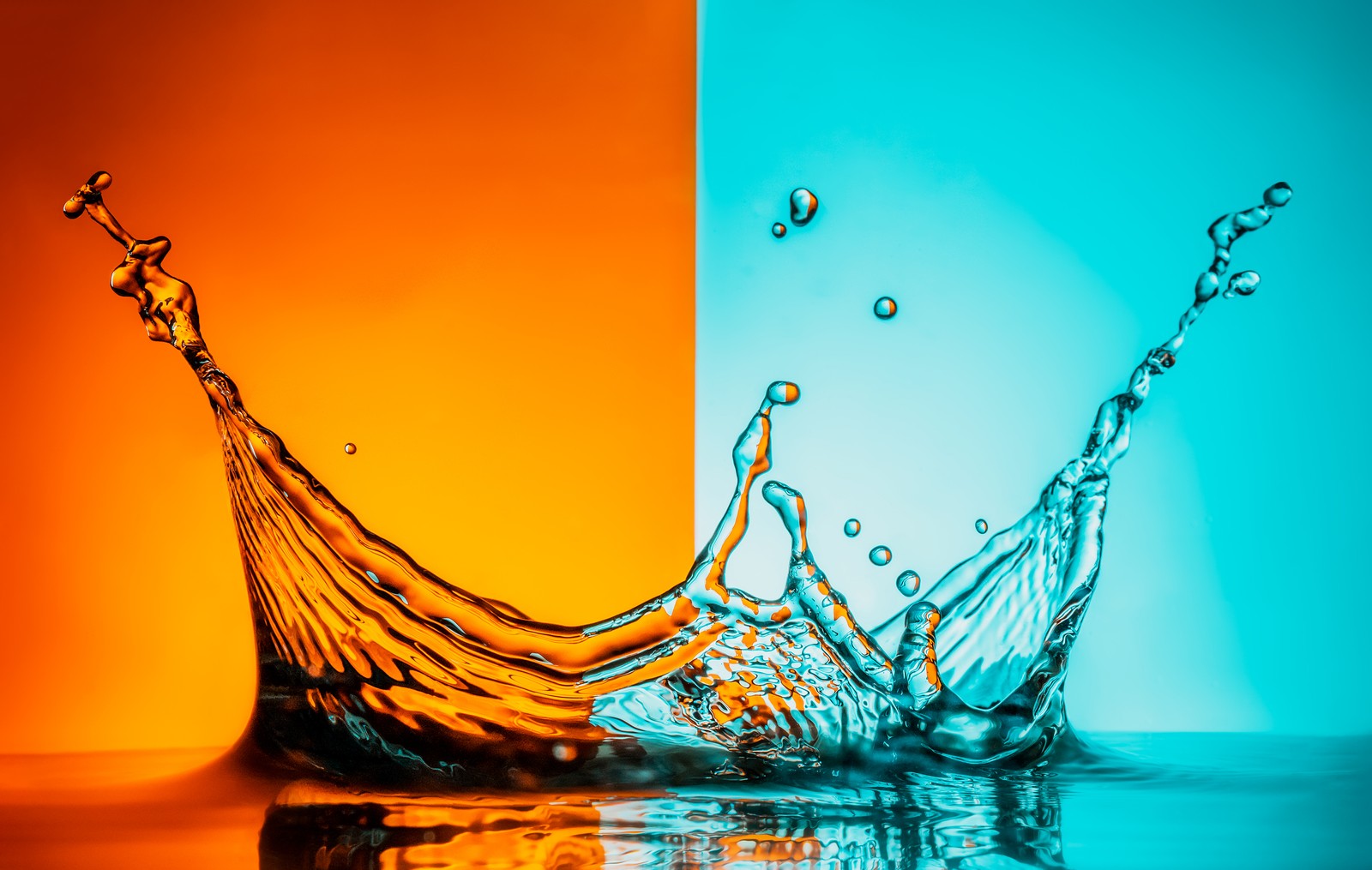 splash, water, orange background, macro, light Download Wallpaper