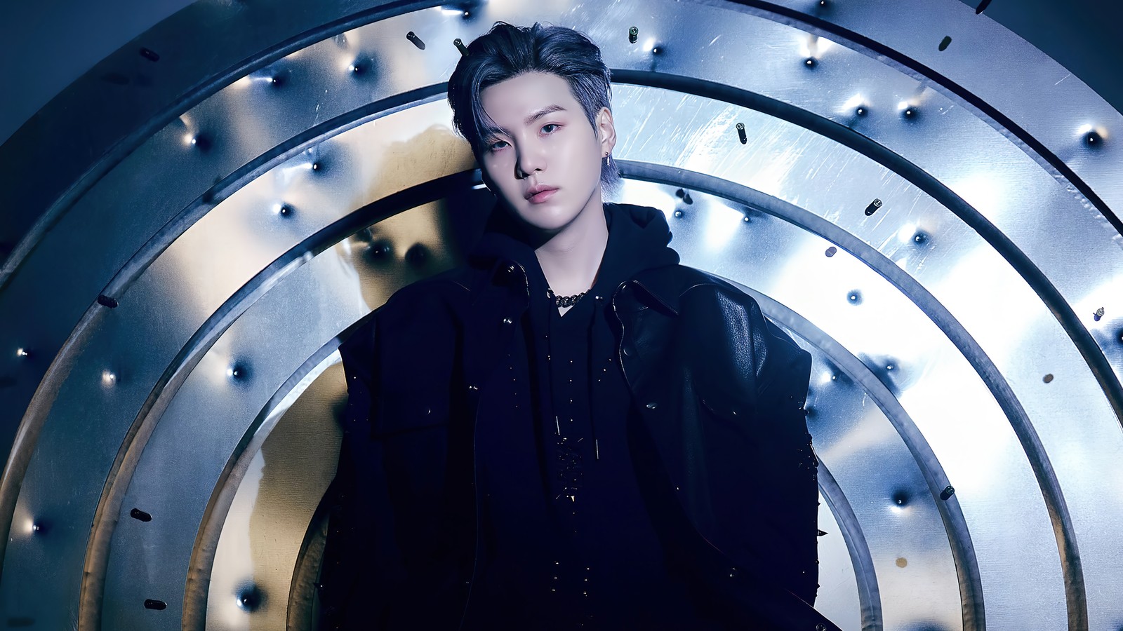 Arafed image of a man in a black jacket standing in a metal tunnel (bts, 방탄소년단, bangtan boys, kpop, k pop)