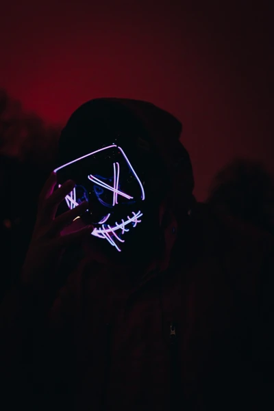 Illuminated Mask in the Darkness: A Magenta Portrait