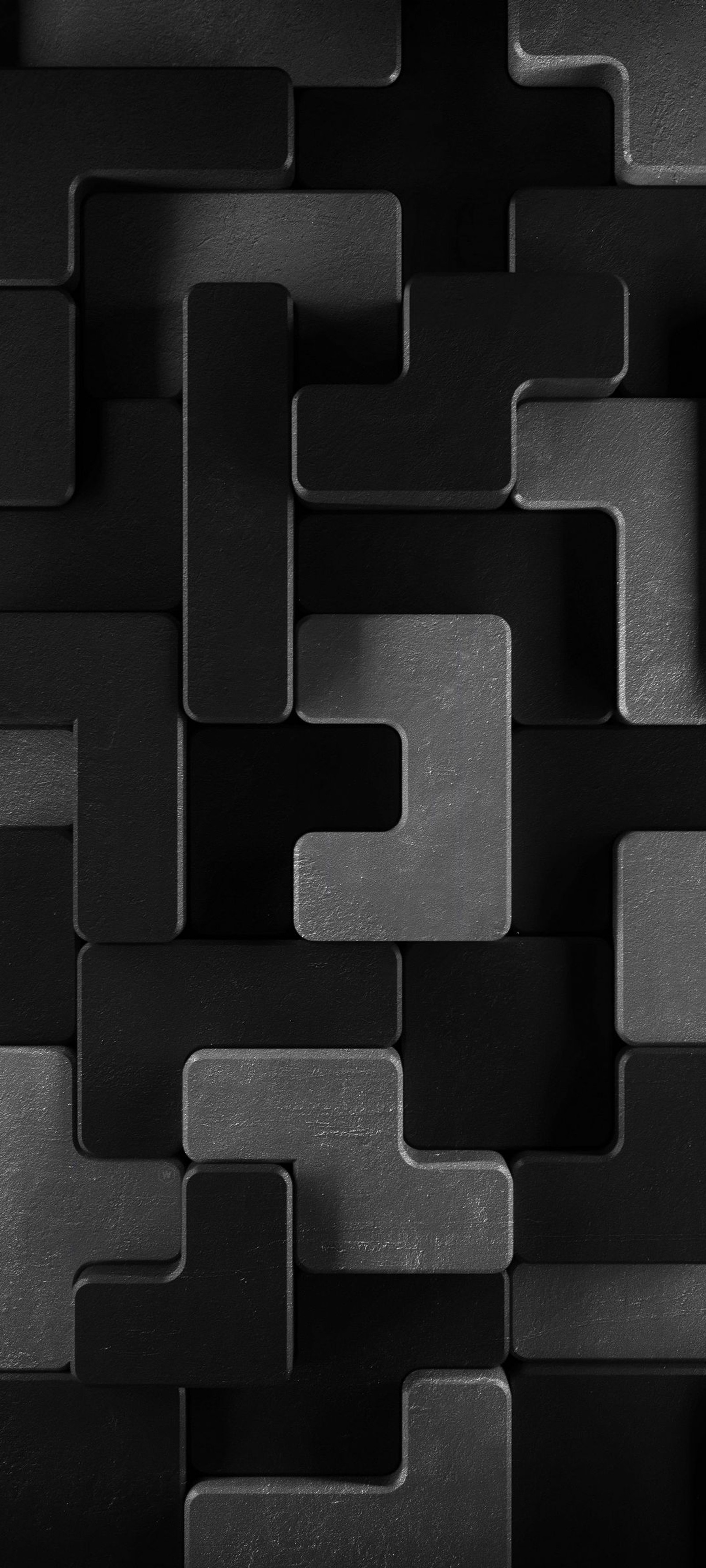 A close up of a black and white photo of a wall of squares (black and white, grey, rectangle, pattern, automotive tire)