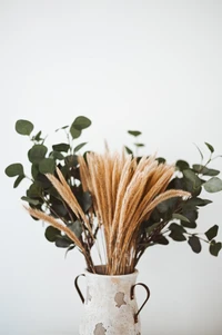 Dried Floral Arrangement in Rustic Vase with Greenery