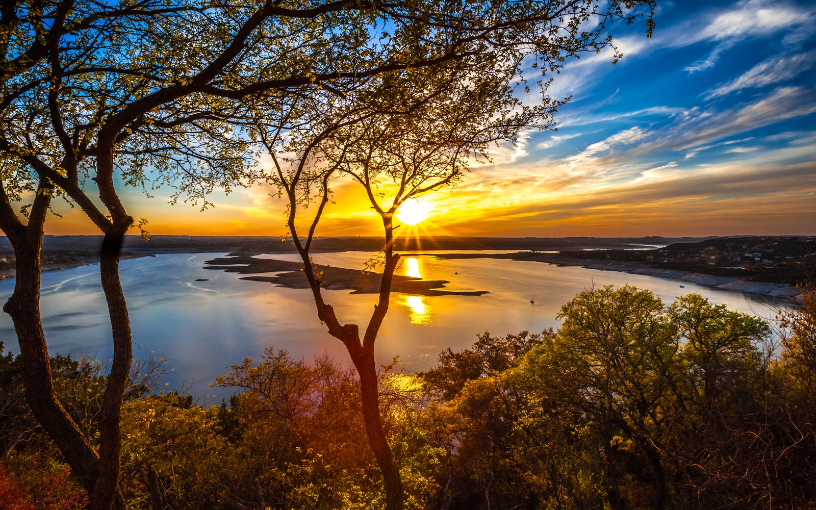 A sunset view of the lake and trees from a hill (nature, sunrise, sunset, reflection, morning)