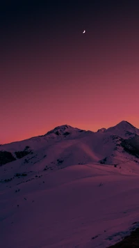 Winter Landscape at Dusk with a Crescent Moon over Snow-Capped Mountains