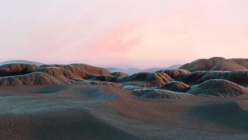 Um close-up de um deserto com um céu rosa ao fundo. (paisagem, cenário)